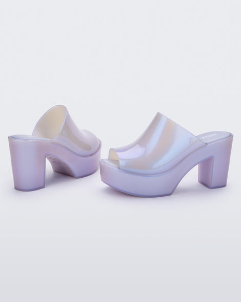 Side and back view of a pair of pearly purple Melissa Mule platform heels.