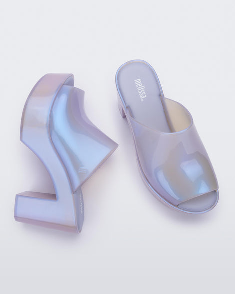 Side and top view of a pair of pearly purple Melissa Mules platform heels.