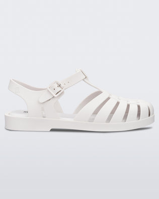 Side view of a white Melissa Possession sandal with several straps and a closed toe front.