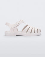 Side view of a white Mini Melissa Possession sandal with several straps and a white base.