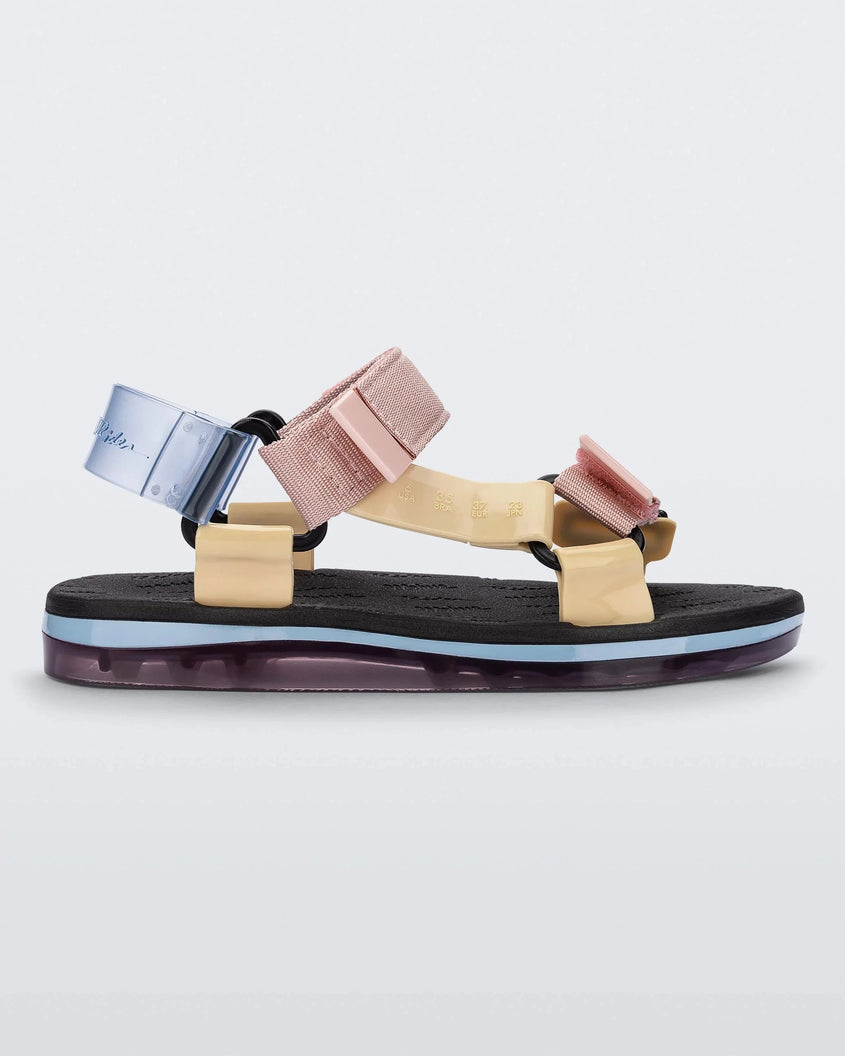 Side view of a black soled Melissa Papete sandal with transparent blue, pink and beige straps.