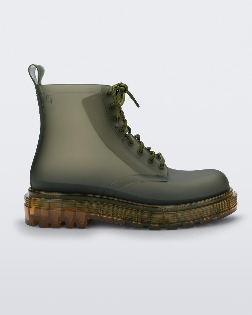 Side view of a clear green/yellow Melissa Coturno boot with a green base, laces and a yellow sole.