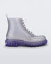 Side view of a lilac/silver glitter Melissa Coturno with a clear silver glitter base, white laces and a lilac sole.