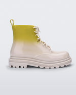 Side view of a beige/green Melissa Coturno boot with a green into beige ombre base, beige laces and sole.