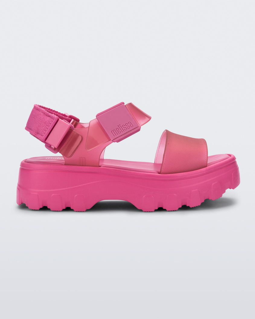 Side view of a pink/clear pink Melissa platform Kick Off sandal with two straps.