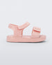 Side view of a pink Mini Melissa Jump sandal with velcro straps.