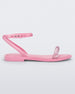 Side view of a pink Melissa Wave Sandal with a clear pink front strap and a pink ankle strap and sole.