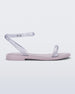 Side view of a lilac/clear glitter Melissa Wave Sandal with a lilac base and a clear glitter front and ankle straps.