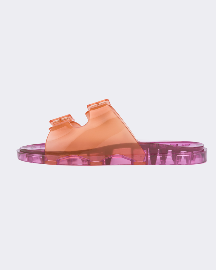 Inner side view of a Melissa Wide slide sandal with pink sole and two orange front straps