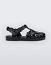 Side view of a Melissa Possession fisherman sandal in black with cut out lace detail on the straps.