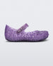 Side view of Mini Melissa Campana purple glitter flats with a snap strap for baby with an open woven texture