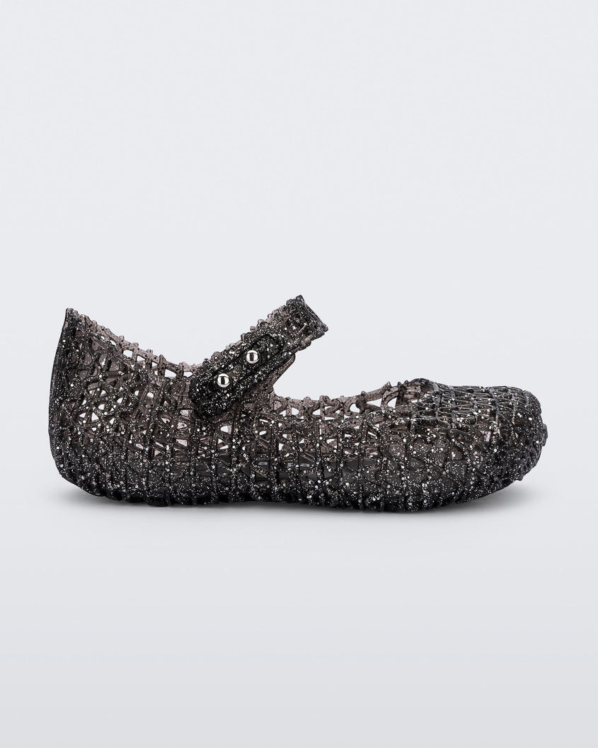 Side view of a Mini Melissa Campana ballet flat in black glitter for baby.