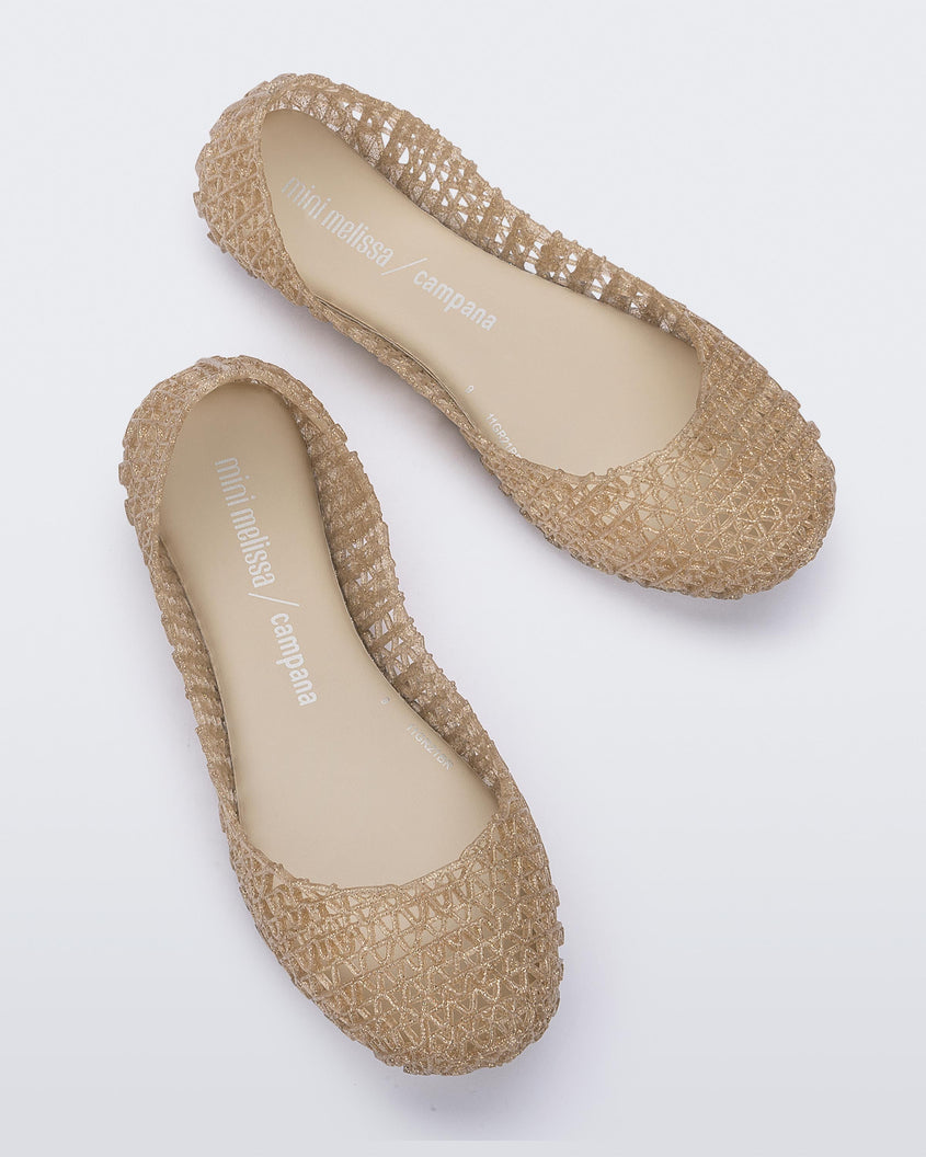 Top view of a pair of Beige/Glitter Mini Melissa Campana flats with a woven detail base.