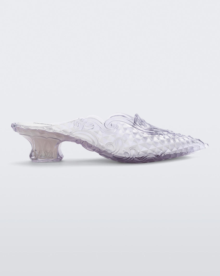 Side view of a clear white Melissa Court heel with a heart detail on the front and a checkered pattern texture.
