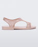 Side view of a transparent pink glitter Melissa Bikini Sandals with two transparent pink glitter straps conjoining in the middle and a pink insole.
