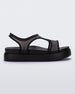 Side view of a black Melissa Bikini Platform sandal with two transparent black straps conjoining in the middle and a black sole.