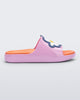 Side view of a pink/orange Mini Melissa Cloud slide with an orange insole, pink base and a flower detail on the front.