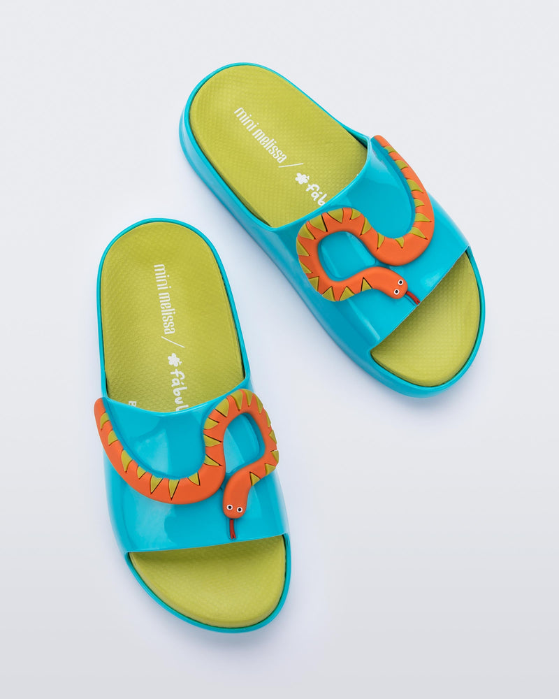 Top view of a pair of blue/green Cloud + Fábula kids slides