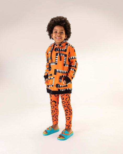 Child model wearing a pair of blue/green Cloud + Fábula kids slides