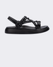 An outter side view of a black Melissa Papete Essential sandal with straps.