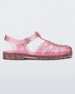 Side view of a pink glitter Melissa Possession Shiny sandal with several straps and a closed toe front.