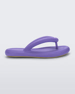 Side view of a lilac Melissa Free Flip Flop with puffer-like straps.