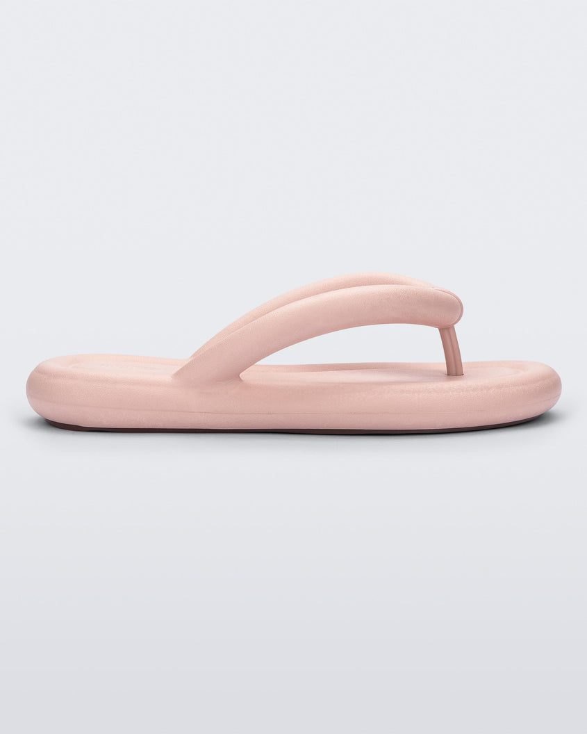 Side view of a light pink Melissa Free Flip Flop with puffer-like straps.