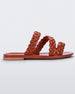 Side view of a brown/beige Melissa Wrap slide with three braid like straps.