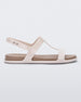 Side view of a beige / brown Melissa Adore sandal with two beige straps, joined together by a third strap and a brown insole.