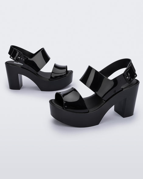 Side view of a pair of black Melissa Mule heel platform Sandals.
