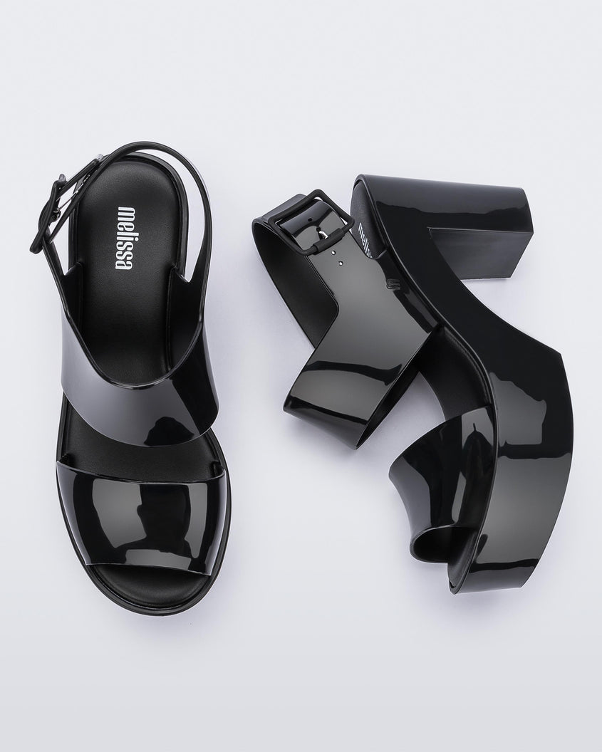 Top and side view of a pair of black Melissa Mule heel platform Sandals.