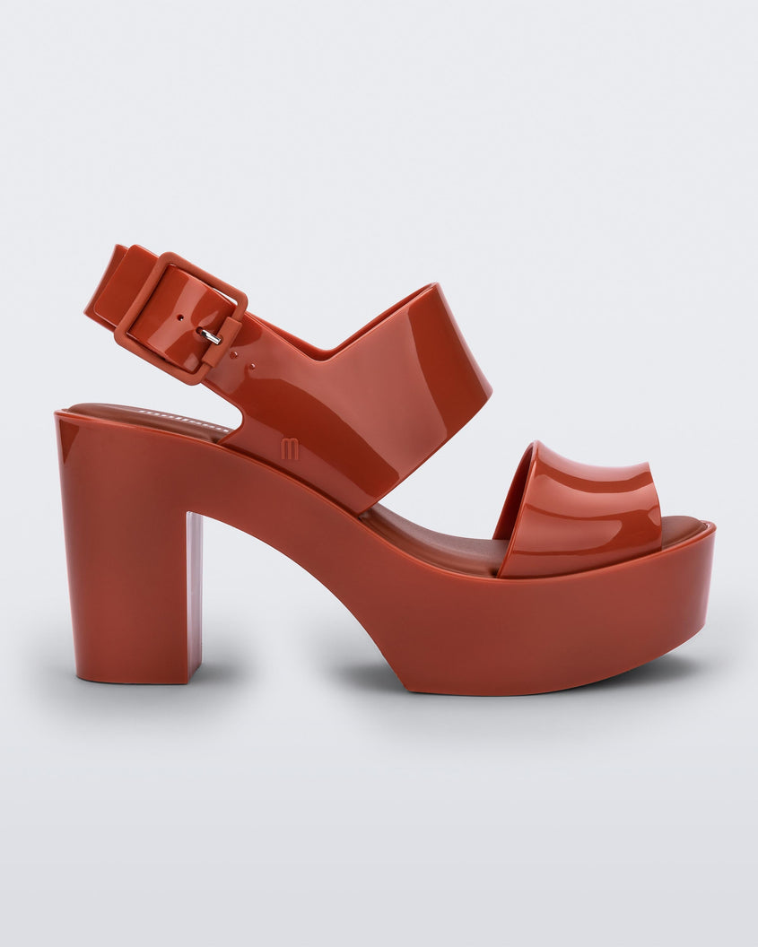 Side view of a red Melissa Mule heel platform sandal.