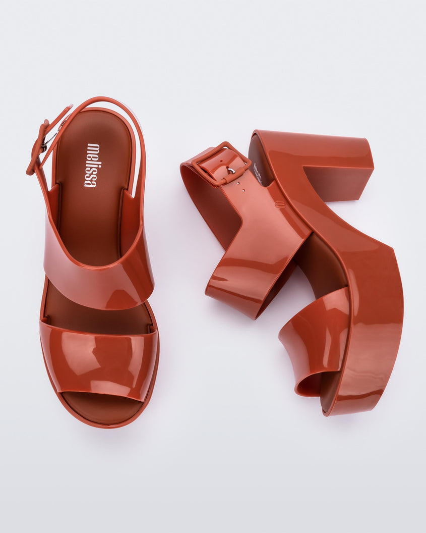 Top and side view of a pair of red Melissa Mule Sandals.