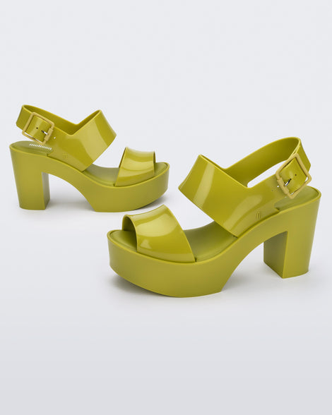 Side view of a pair of green Melissa Mule heel platform Sandals.