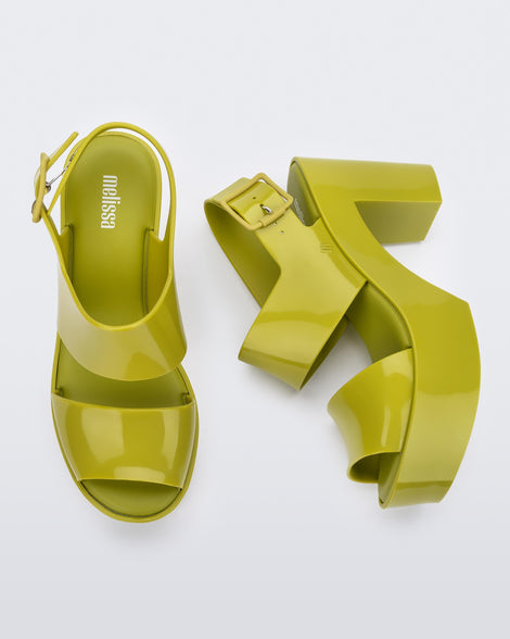 Side and top view of a pair of green Melissa Mule heel platform Sandals.