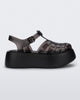 Side view of a black Melissa Possession Platform sandal with several straps and a closed toe front.