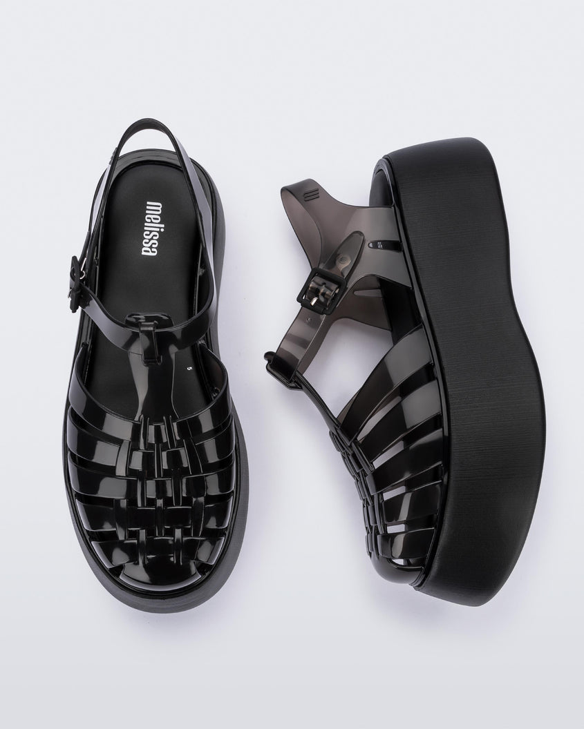 A top and side view of a pair of black Melissa Possession Platform sandals with several straps and a closed toe front.