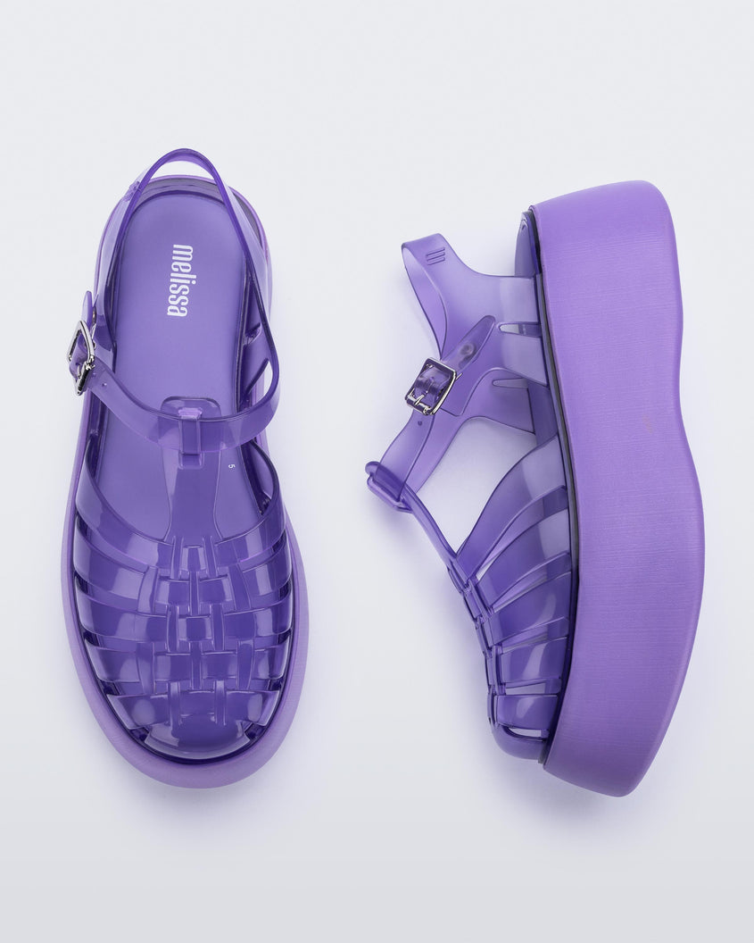 A top and side view of a pair of a lilac Melissa Possession Platform sandals with several straps and a closed toe front.