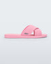 Side view of a pink Melissa Sun City Walk slide with a melissa logo on the side and two overlapping straps.