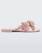 Side view of a light pink Melissa Harmomic Squared Garden flip flop with flowers on the straps.
