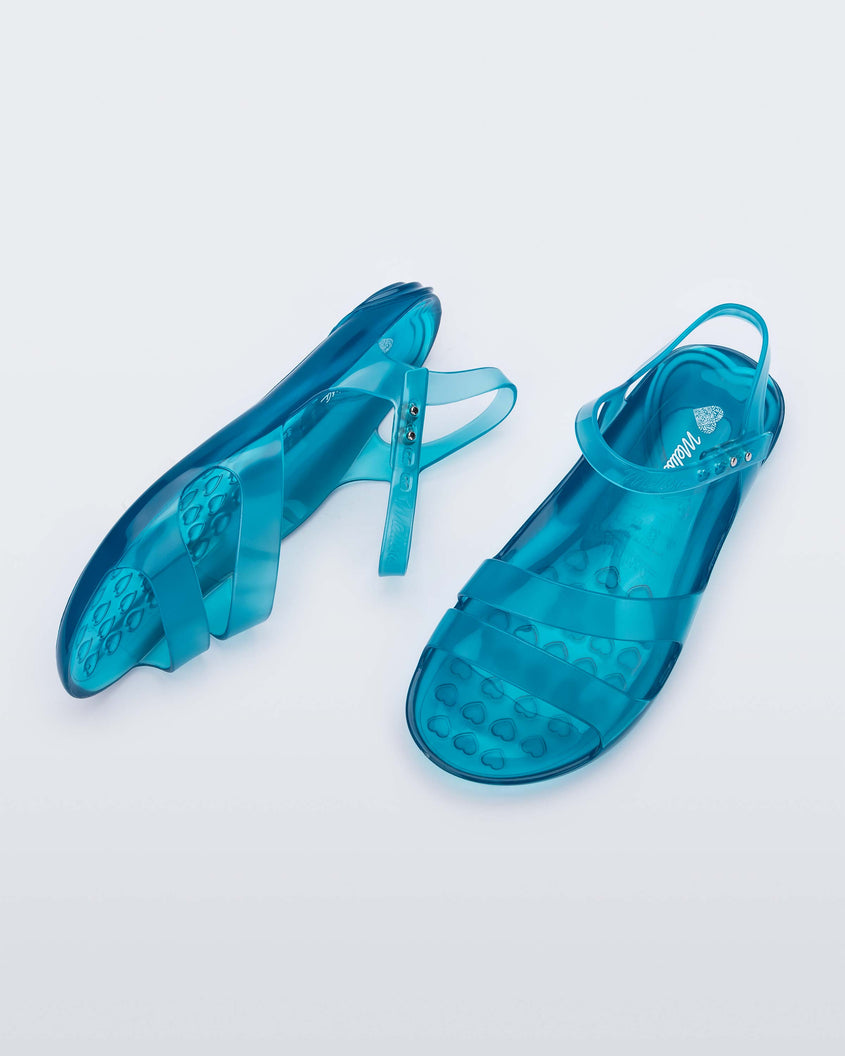 A top and side view of a pair of blue Melissa Real Jelly Sandals with two front straps and an ankle strap.