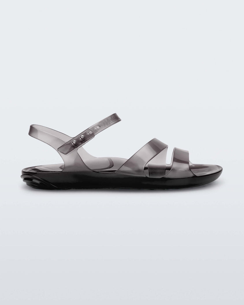 Side view of a black Melissa Real Jelly Sandal with two front straps and an ankle strap.