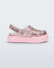 Side view of a pink/glitter Mini Melissa Sunday sandal with a glitter base, closed toe front and pink sole.