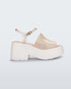 Side view of a White/Beige Melissa Pose platform sandal with a beige front strap, a clear beige ankle strap and a white sole.