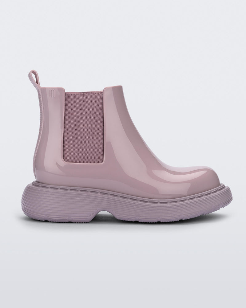 side view of a Melissa Step slip on ankle boot in Lilac with lug sole. 