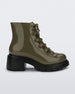 Side view of a black/green Melissa Cosmo boots with a green base, laces and a black heel sole.