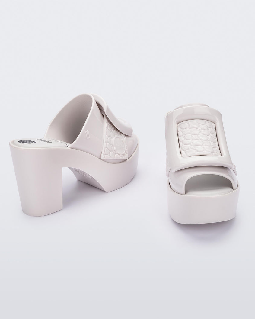 Angled view of white Meilssa Buckle Up platform heel mule..