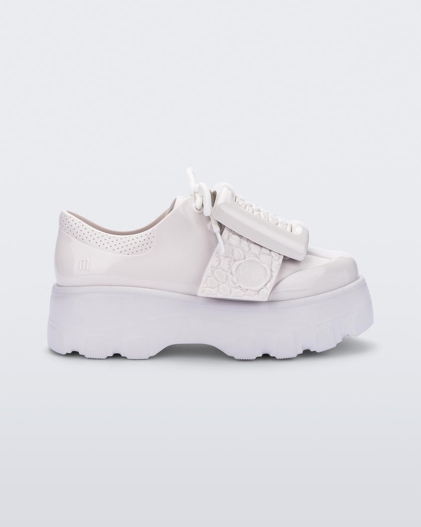 Side view of white Melissa Buckle Up Kick Off platform sneaker.