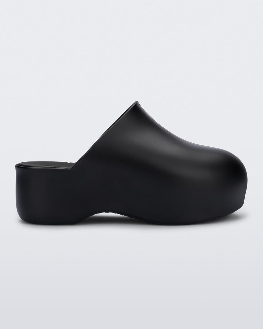 Side view of black Melissa Bubble clog from the Simon Miller collaboration.