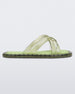 Side view of transparent green Melissa Cali slides with cross straps.
